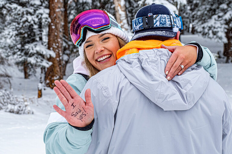 She said yes to his marriage proposal near Vail, CO while snowmobiling with Nova Guides