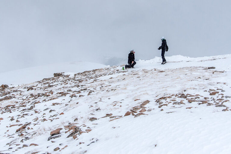 On top of the Colorado Rockies for this wind blown marriage proposal near Vail, CO