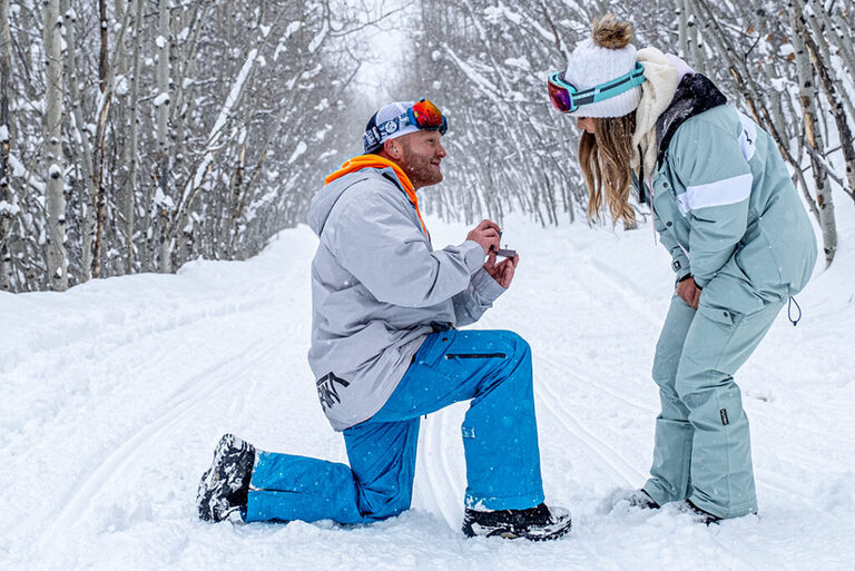Snowy day marriage proposal captured near Vail, CO using Nova Guides snowmobiles